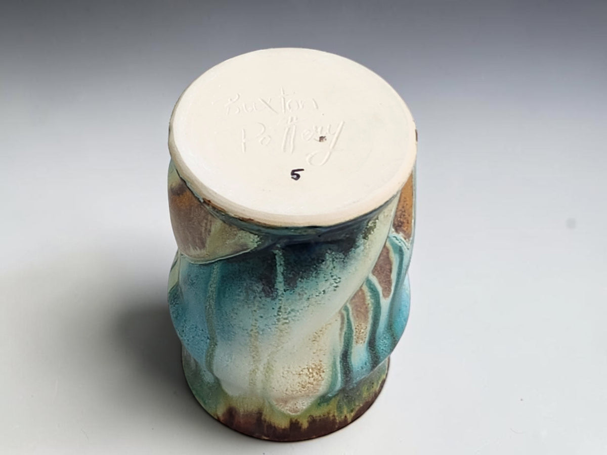 Bush Creek coffee mug showing its base and blue glaze detail near the base.