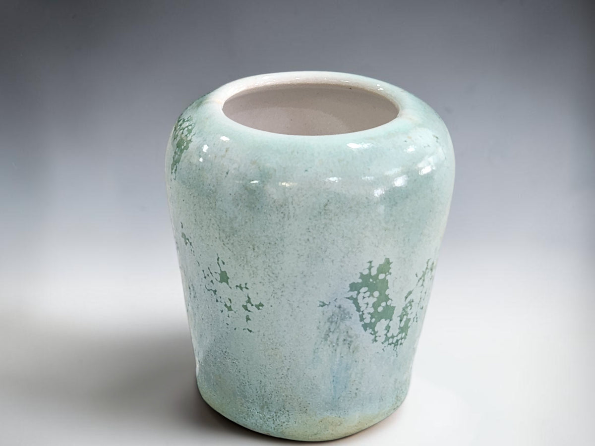 Compact ceramic vase measuring approximately 6 cm at its widest point