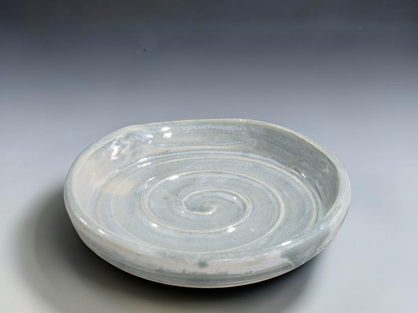 Handmade ceramic kitchen spoon holder in soft blue grey glaze with subtle edge variation