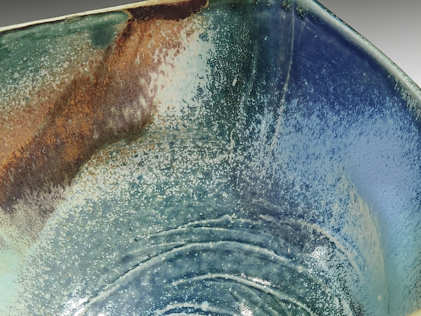 ceramic bowl glaze detail mottled blue green brown rustic pottery close up