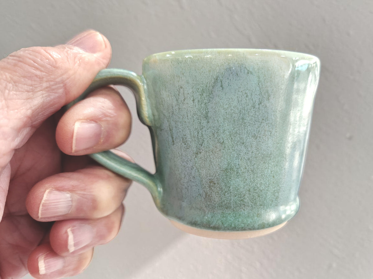 Small one-finger handle on green Australian pottery espresso cup