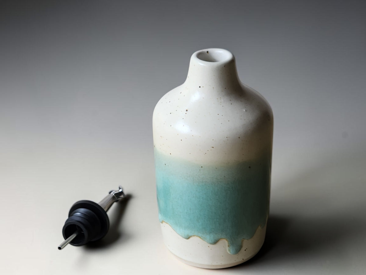 Ceramic kitchen oil dispenser bottle with mint green glaze and speckled finish