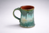 Handmade ceramic mug angled view highlighting glaze drips and speckling, handmade pottery mug Australia
