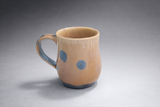 Handmade ceramic mug lifestyle shot amber glaze blue crystalline pottery Australia
