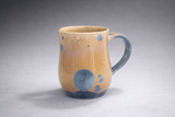 Handmade ceramic coffee mug comfortable handle detail blue and amber glaze