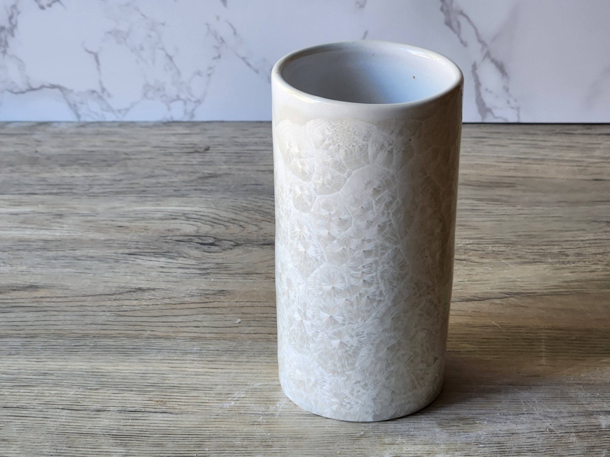 Handmade crystalline pottery tumbler or vase in white glaze
