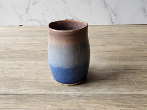 Handmade Artisan stoneware mug with soft blue glaze accents