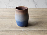 Handmade Artisan stoneware mug with soft blue glaze accents