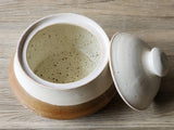 Handmade pottery storage canister – rustic cream and red tones