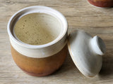 Interior view of Handmade ceramic jar with speckled cream and red-brown layered glaze