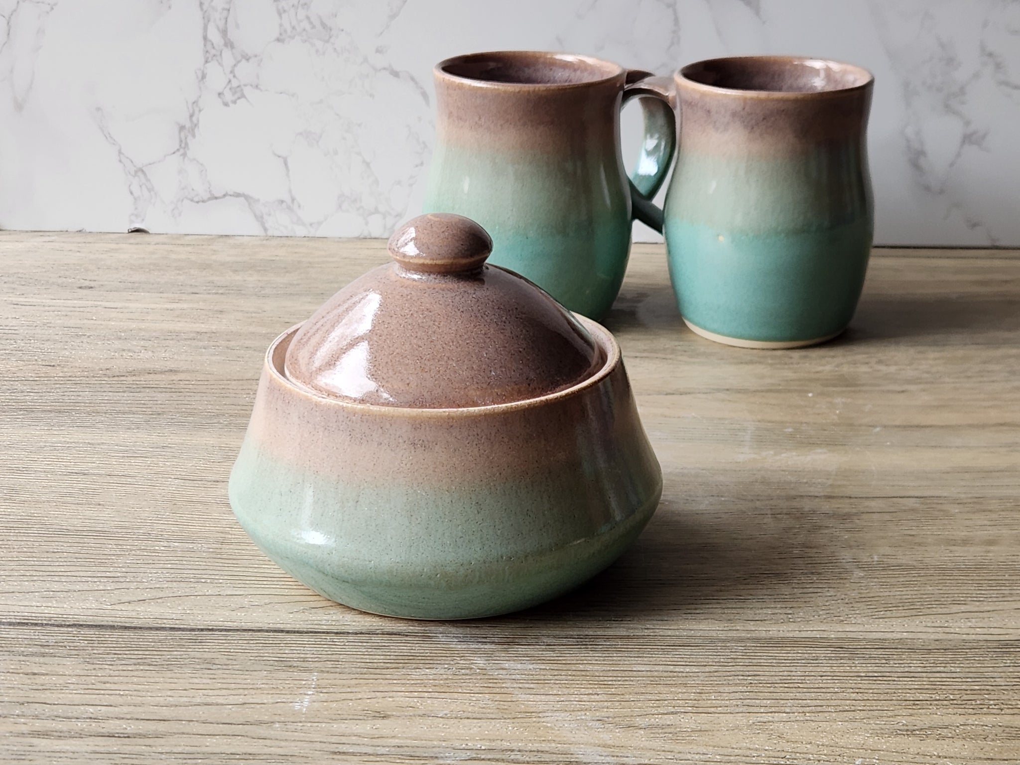 Handmade ceramic sugar bowl with oatmeal glaze and spearmint green panel – Melbourne pottery