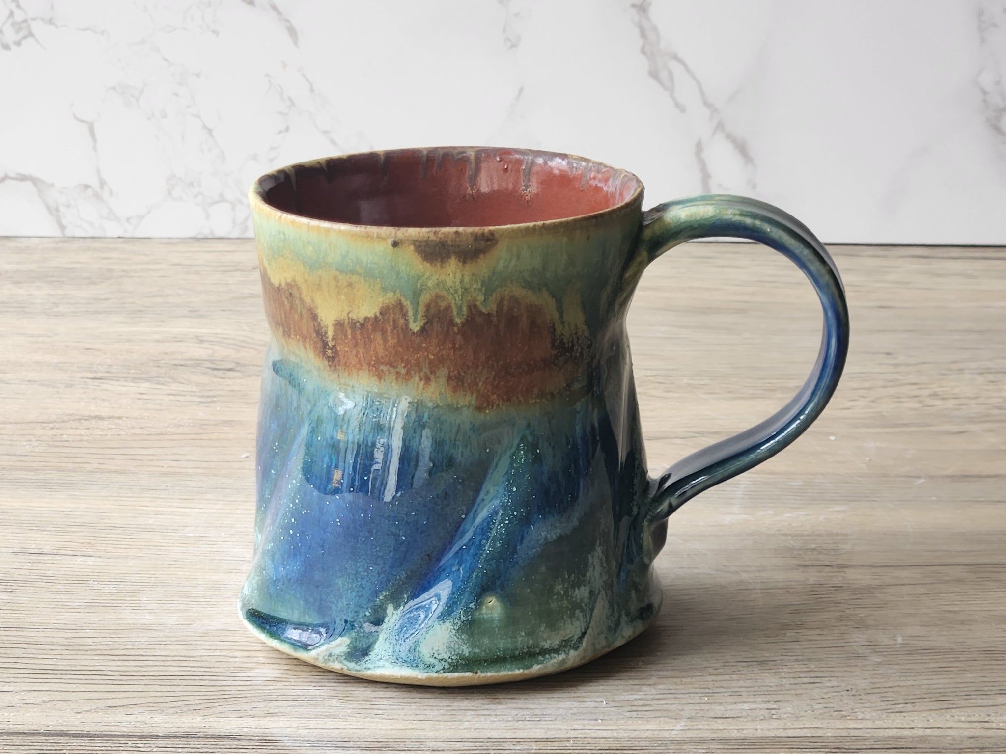 Handmade Rustic Ceramic Mug – 350ml – Altered Form with Red-Brown, Blue & Green Glaze - Buxton Pottery