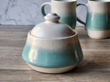 Sugar bowl Glazed in soft mottled green and satin buttermilk