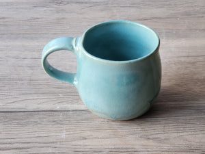  top view of Handmade ceramic mug with glossy turquoise glaze, made in Melbourne