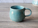 Wheel-thrown pottery mug in soft aqua green glaze, 350ml capacity