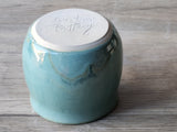View of the bottom of Australian handmade pottery mug in calming ocean-inspired glaze