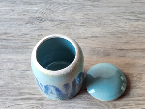 Inside view of a handmade pottery sugar bowl with a lid