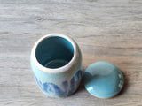 Inside view of a handmade pottery sugar bowl with a lid