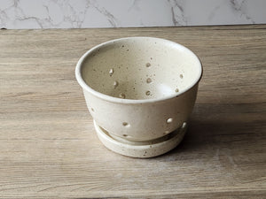 Wheel-thrown speckled cream ceramic bowl with drip tray