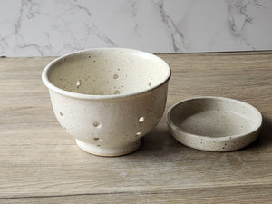 Handmade pottery fruit bowl with matching saucer