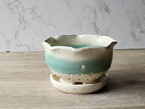 Handmade ceramic fruit bowl with speckled cream glaze