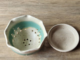 Speckled cream handmade ceramic bowl with green ribbon of glaze