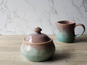 Handmade stoneware jar with oatmeal brown and spearmint green glaze
