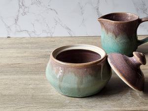Artisan pottery jar with spearmint green accent panel on the bottom.