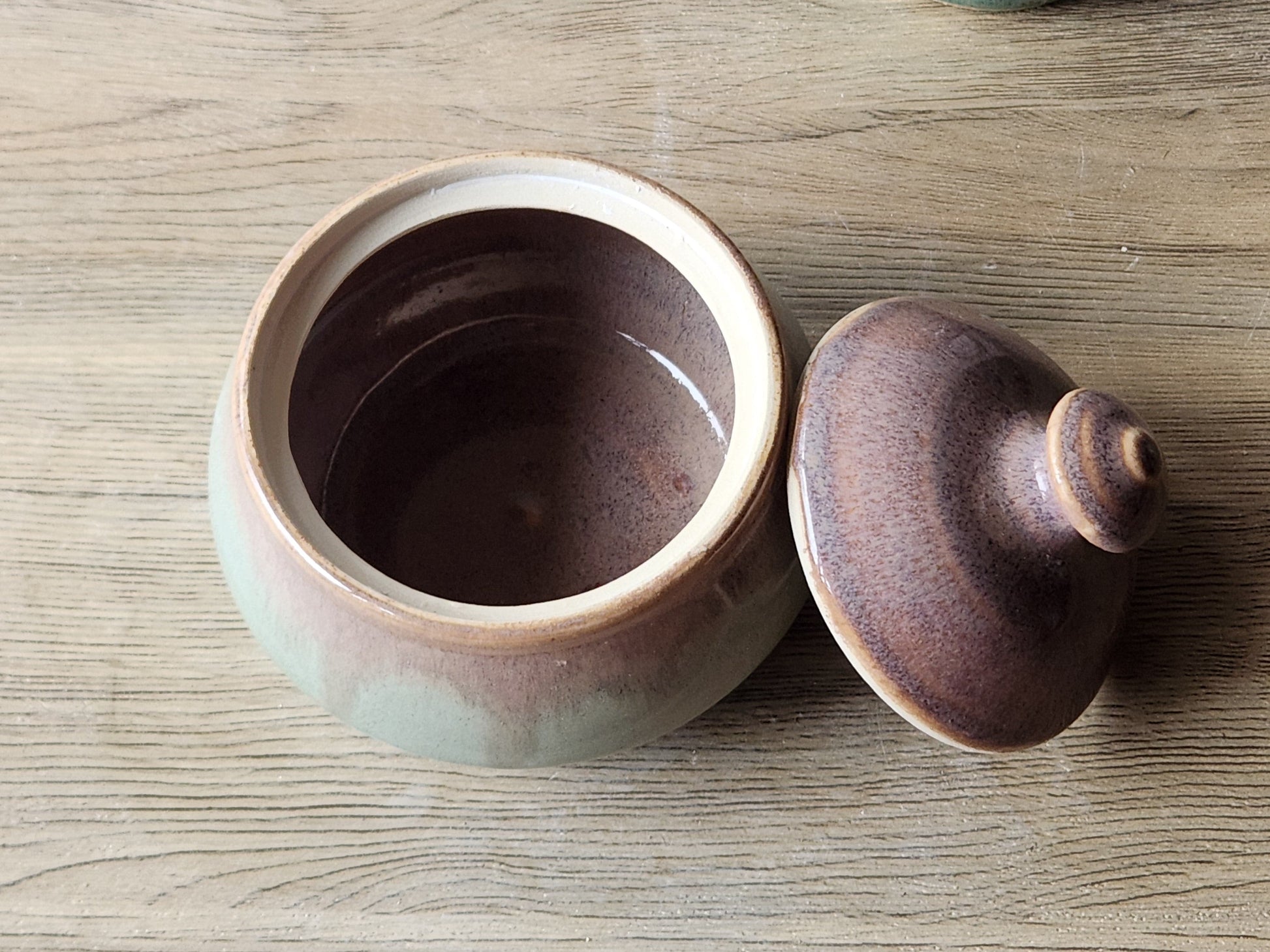 Handmade pottery jar with lid, perfect for home chefs