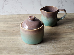Stoneware pottery jar in soft brown with spearmint green accent