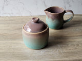 Stoneware pottery jar in soft brown with spearmint green accent