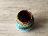 Artisan stoneware yunomi with turquoise drip glaze