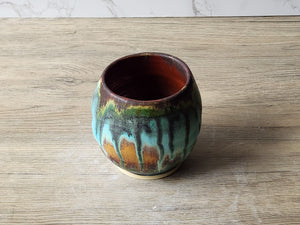 Rustic pottery yunomi with layered turquoise moss glaze