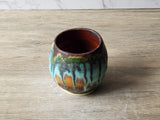 Rustic pottery yunomi with layered turquoise moss glaze