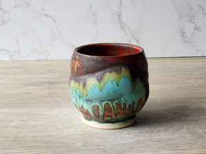Handmade Rustic pottery tea cup with layered turquoise moss glaze