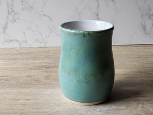 Big handmade stoneware mug with glossy white interior