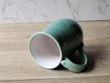 Rustic stoneware mug with natural landscape-inspired glaze