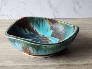 Large pottery display bowl in turquoise and earthy tones
