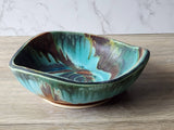 Large pottery display bowl in turquoise and earthy tones