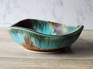 Wheel-thrown ceramic bowl altered with carving and coiling