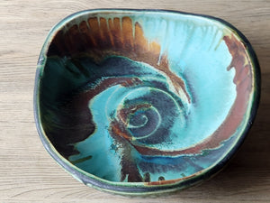 Large stoneware display bowl with turquoise glaze interior