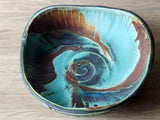 Large stoneware display bowl with turquoise glaze interior
