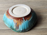 Unique handmade pottery bowl with organic glazed form