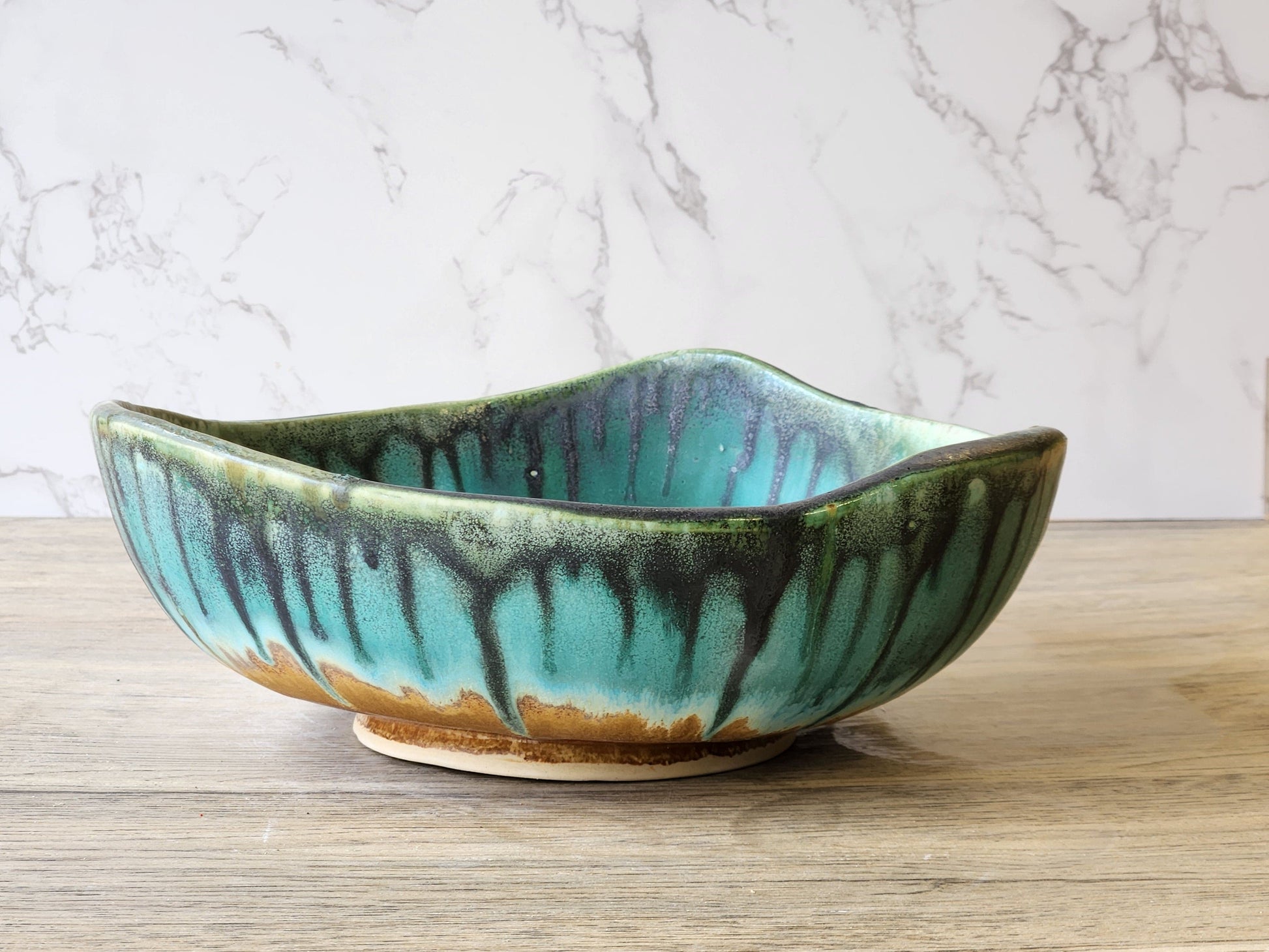 Large pottery display bowl in turquoise and earthy tones