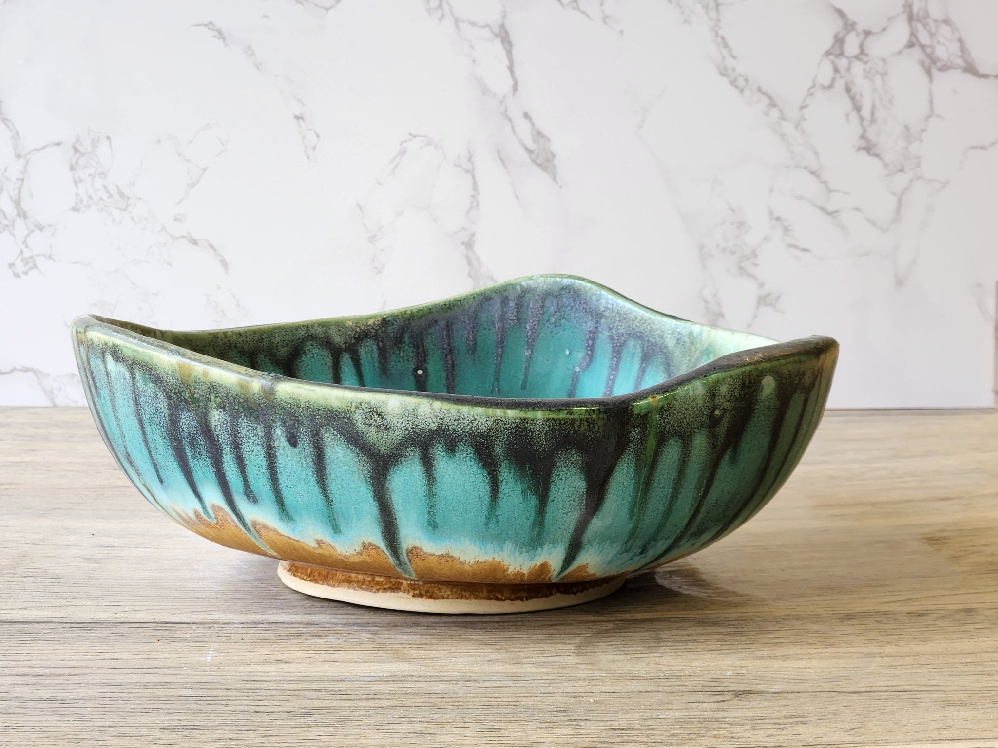 Large pottery display bowl in turquoise and earthy tones
