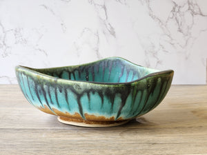 Large pottery display bowl in turquoise and earthy tones