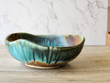 Unique handmade pottery bowl with organic carved form