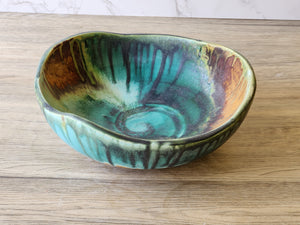 Artisan ceramic serving dish with mottled glaze finish