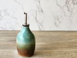 Wheel-thrown pottery oil cruet with food-safe glaze