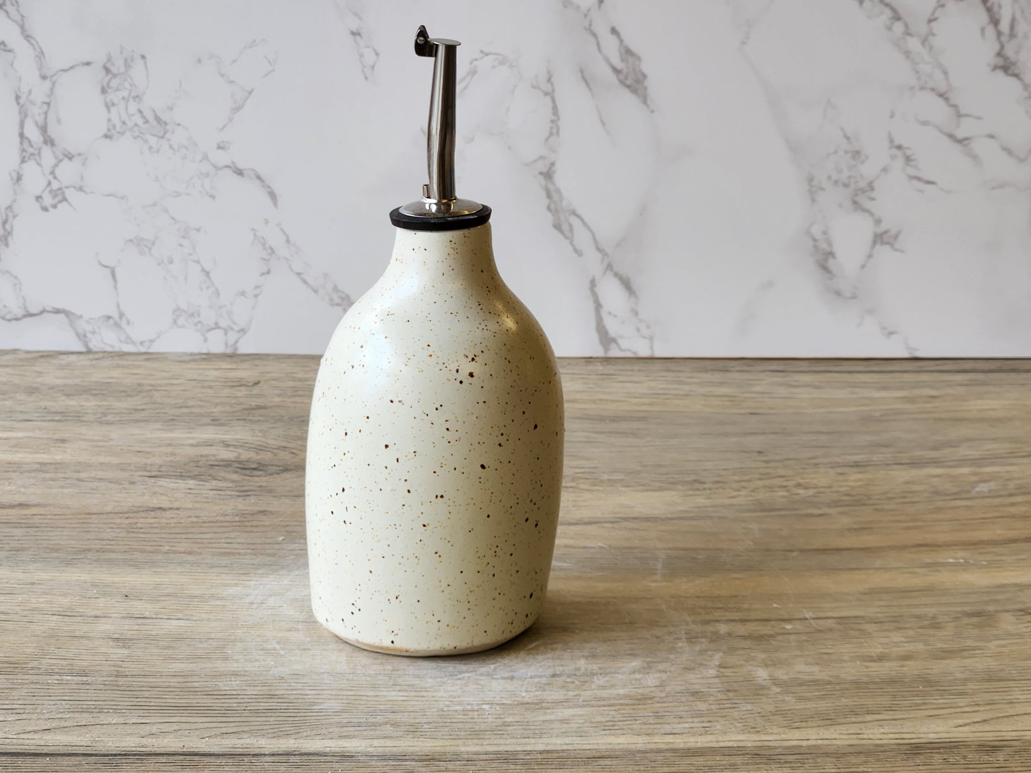 Wheel-thrown pottery oil cruet with food-safe glaze